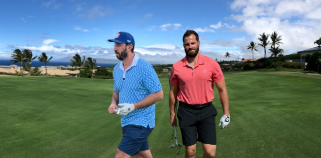 FHADE founders walking together on a golf course fairway overlooking the ocean.