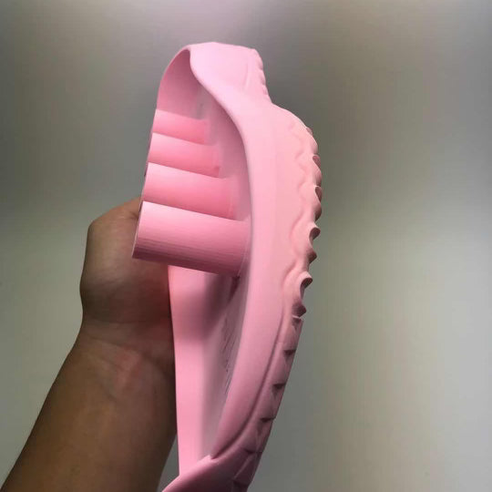 A pink shoe mould that was used in the design process for FHADE's hybrid golf shoe