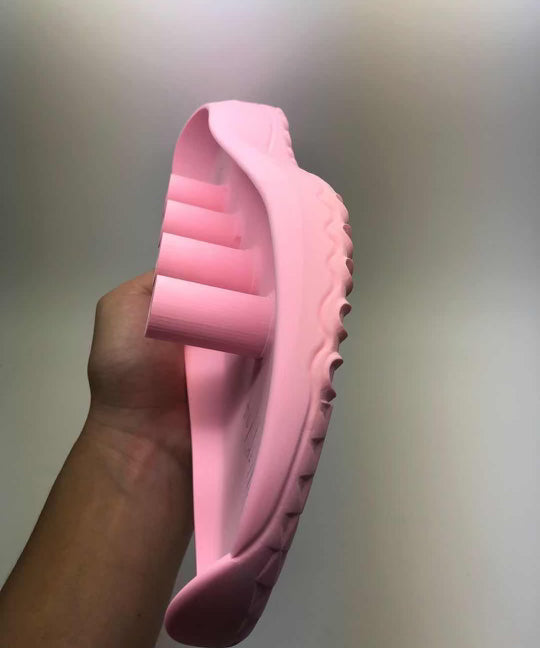 A pink shoe mould that was used in the design process for FHADE's hybrid golf shoe